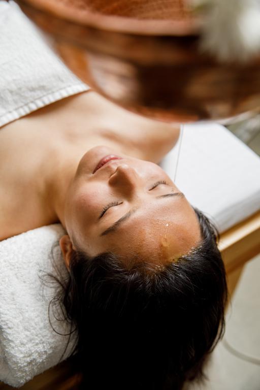 Ancient Secrets to Reducing Stress Through Shirodhara Massage