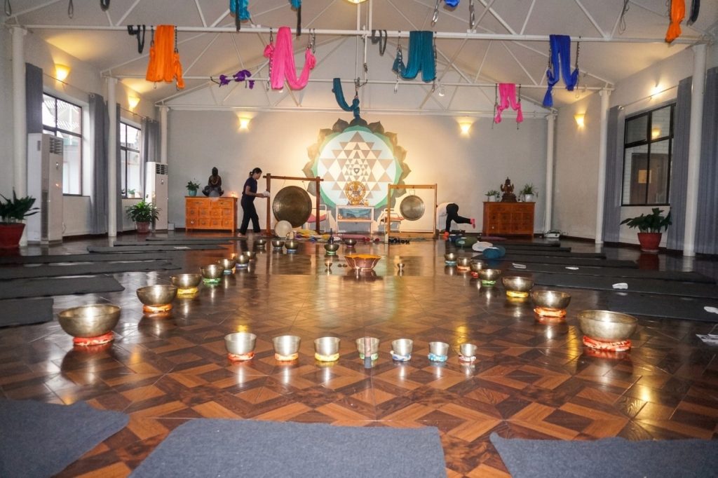 Sound healing session taking place inside the main hall at Avata wellness center.